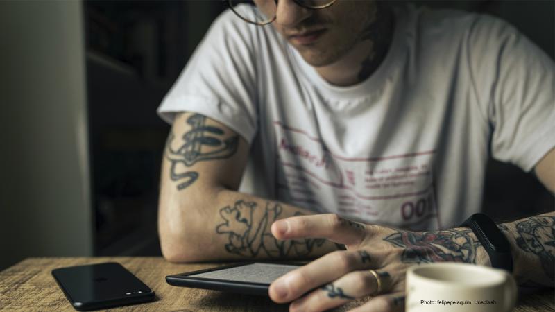 A person reads an e-book.